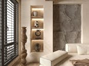 Elegant living room featuring minimalist decor with a luxurious touch and warm lighting.